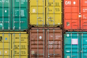 Vibrant cargo containers stacked in a shipping yard highlighting global trade.